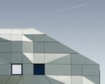 Vertical shot of a geometrical building under the blue sky captured in Paris, France